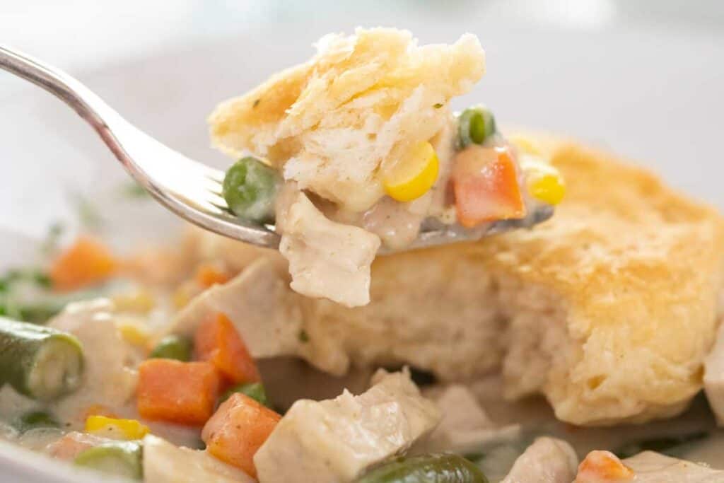 fork with bite of chicken pot pie casserole