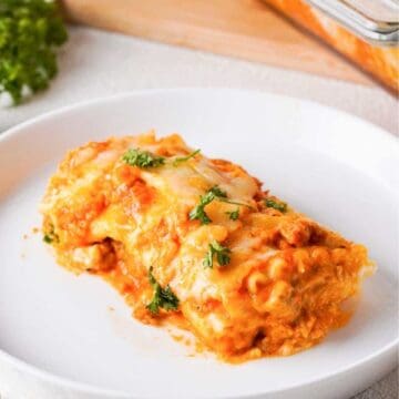 lasagna roll up on white plate