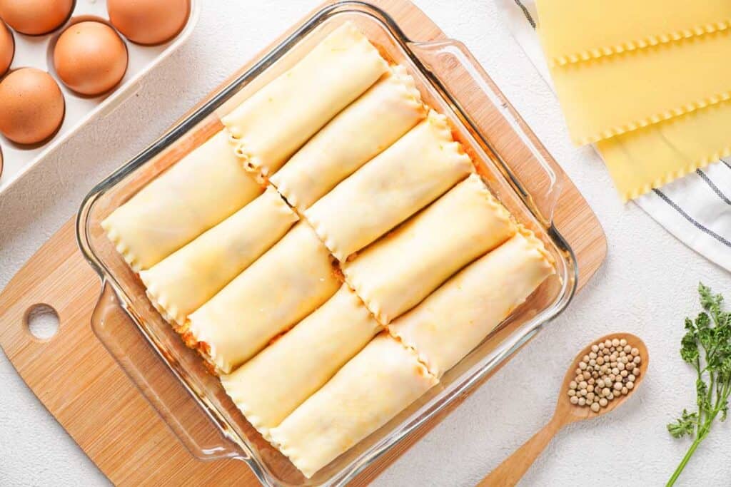 lasagna roll ups in clear baking dish