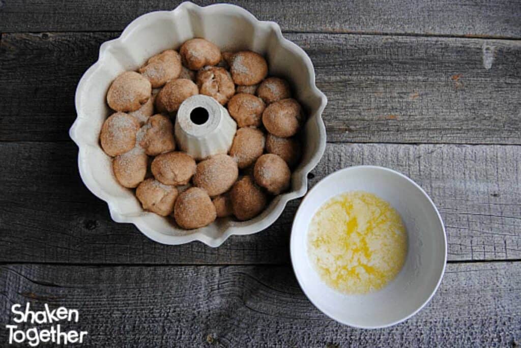 process shot of making monkey bread with dough in bundt pan