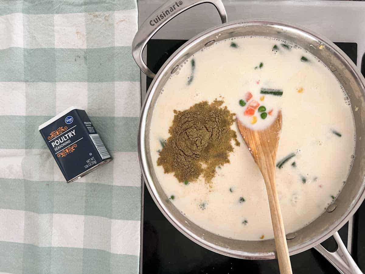 pan with vegetables, creamy sauce, and poultry seasoning