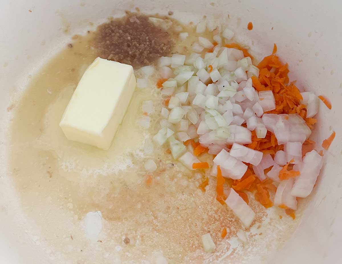 butter, onion, carrots, and seasonings in large dutch oven