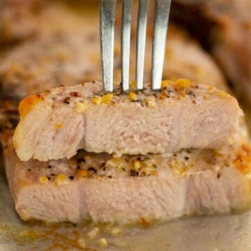 fork piercing two pieces of pork