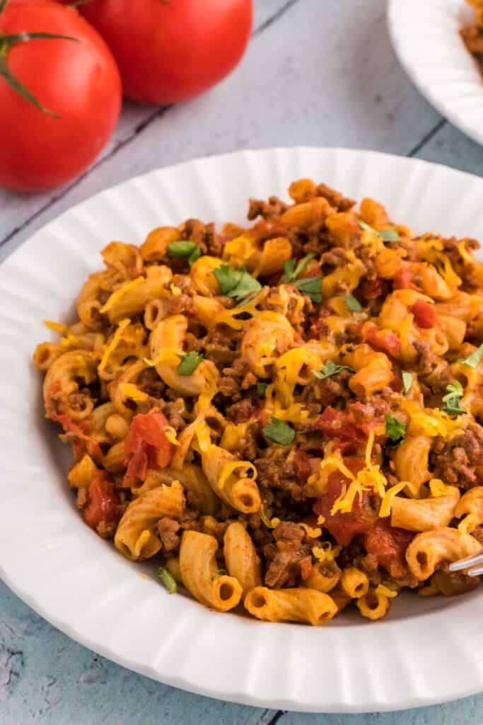 while bowl with taco macaroni and cheese in it