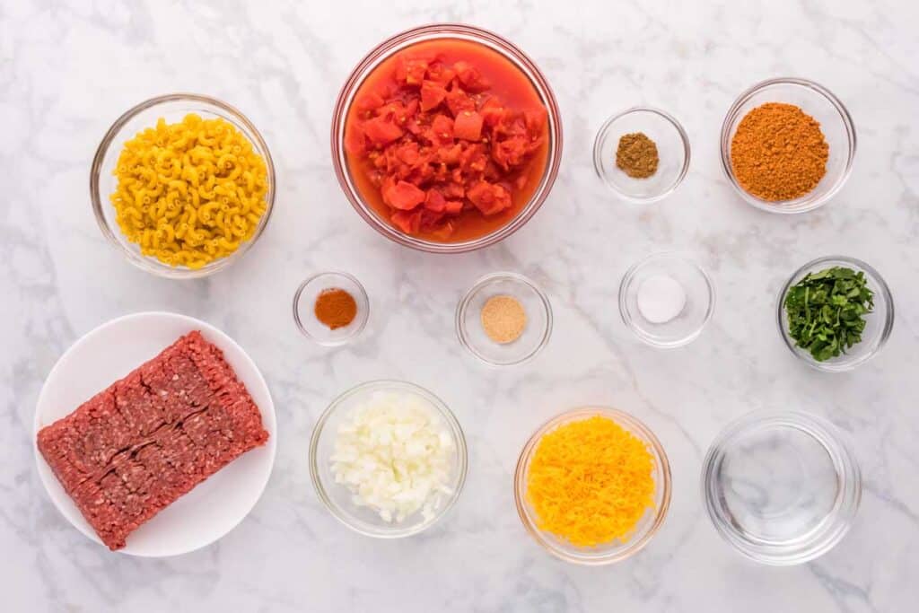 taco mac and cheese ingredients on marble countertop