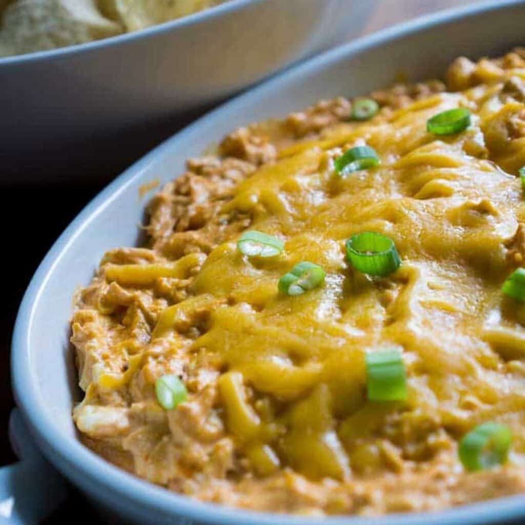 buffalo chicken dip in white casserole dish