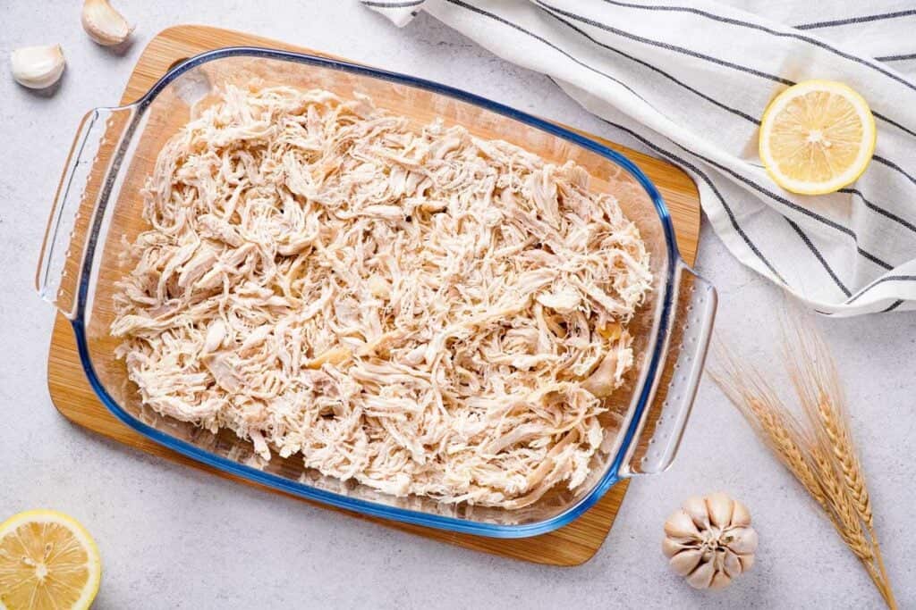 casserole dish with rotisserie chicken covering bottom