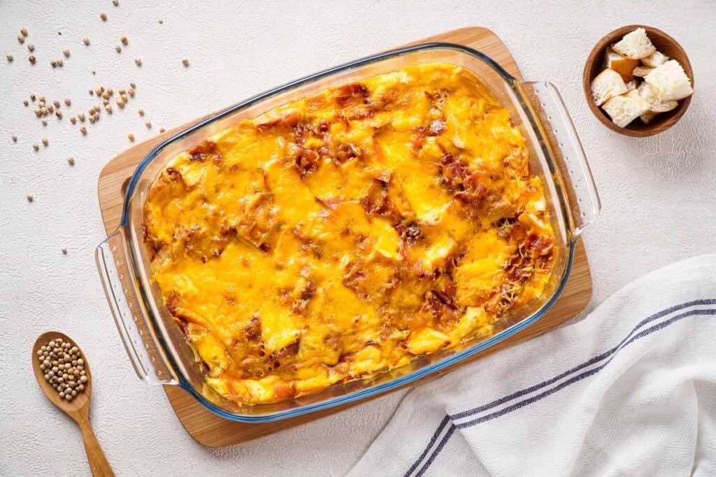 overhead view of everything bagel breakfast casserole in glass dish