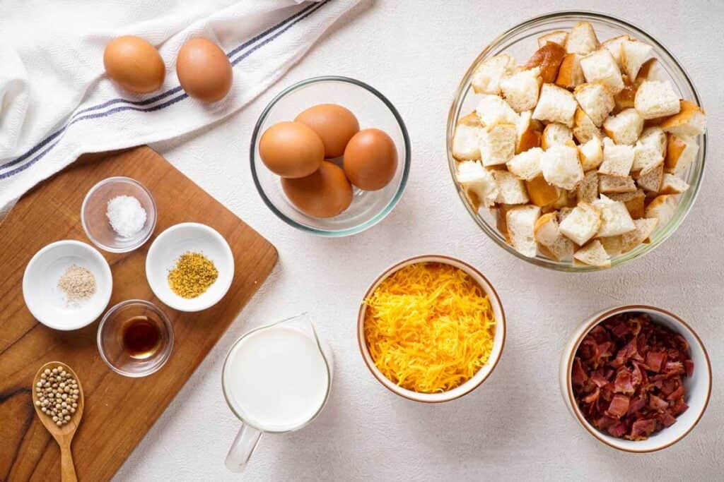 overhead view of everything bagel breakfast casserole ingredients on countertop