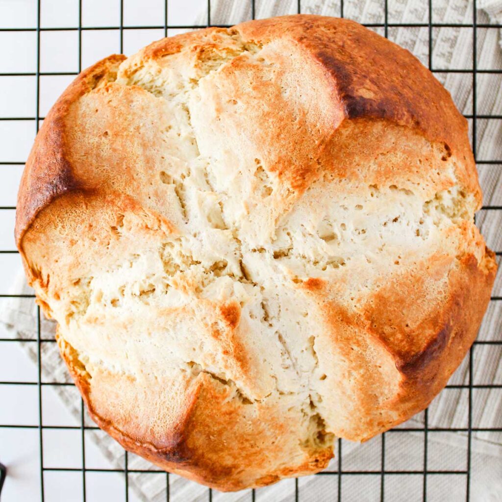 loaf of irish soda bread on wire rack