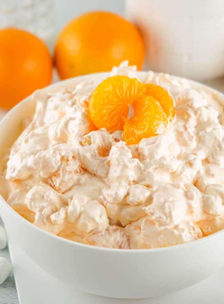 orange fluff salad with mandarin oranges on top