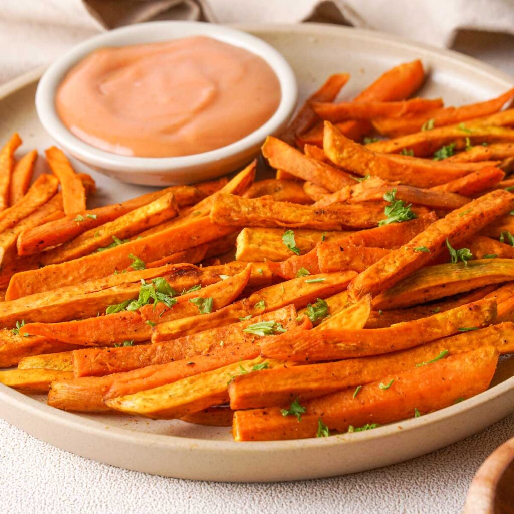 plate with sweet potato fries and dipping sauce