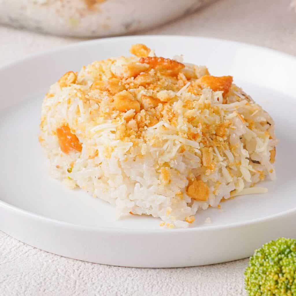 serving of chicken broccoli rice casserole on white plate