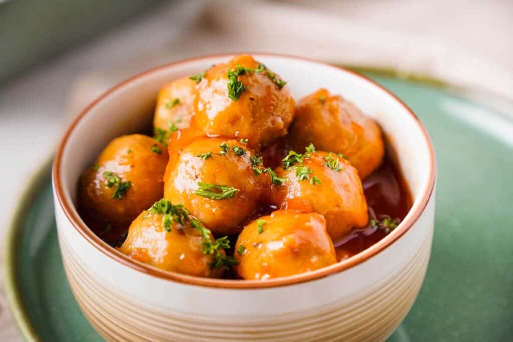 apple jelly meatballs in a bowl