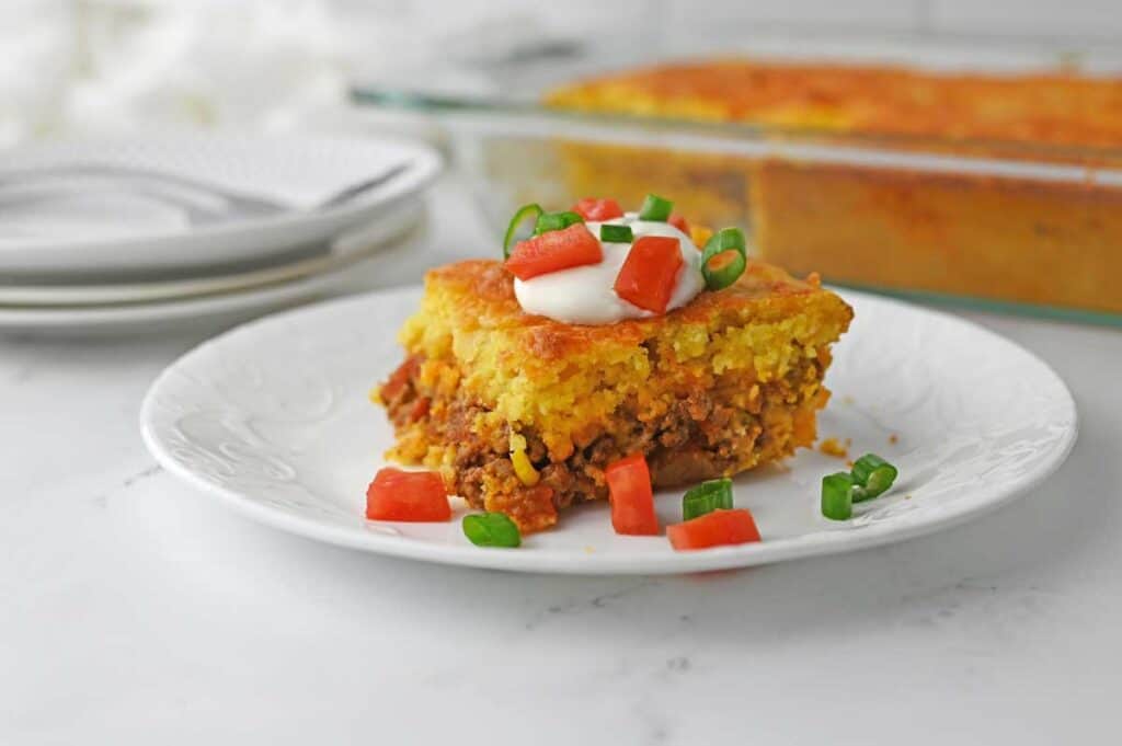 serving of Mexican cornbread casserole on white plate