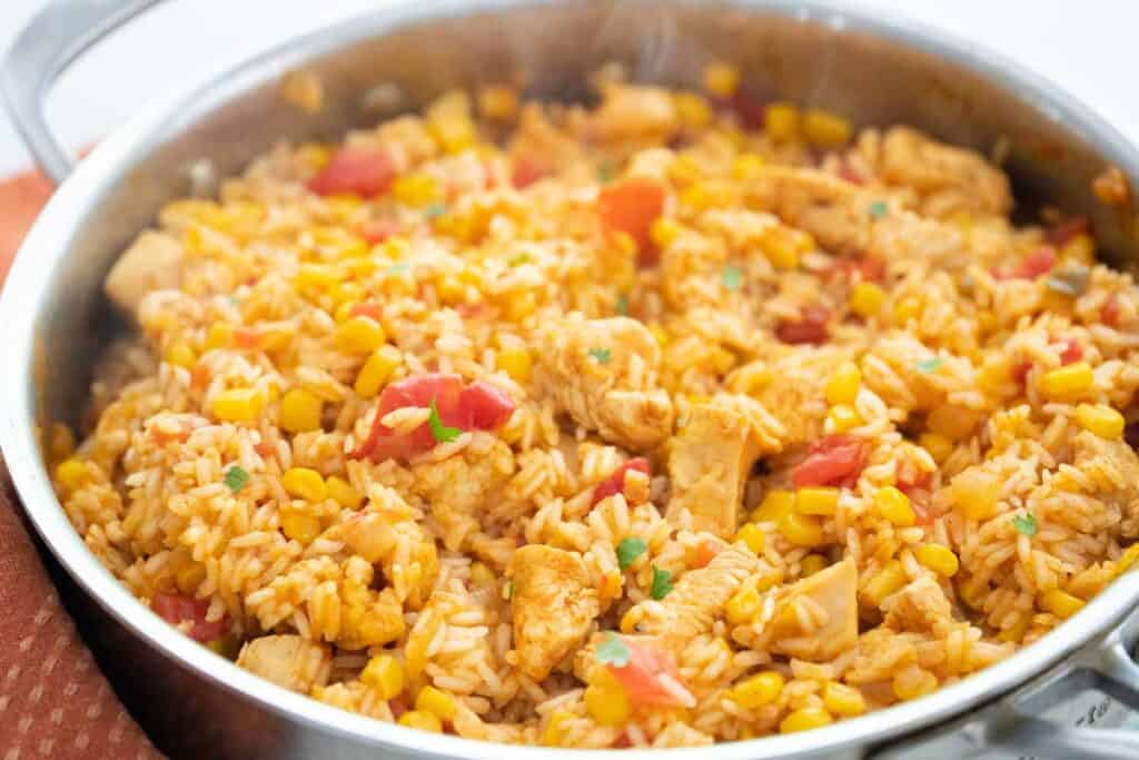 close up of Mexican chicken and rice in a skillet