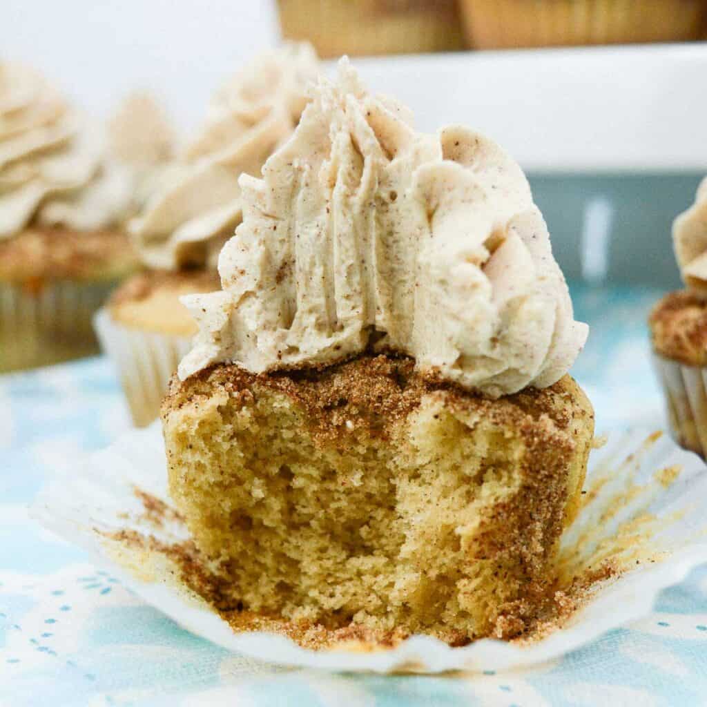 half of a churro cupcake on a cupcake liner