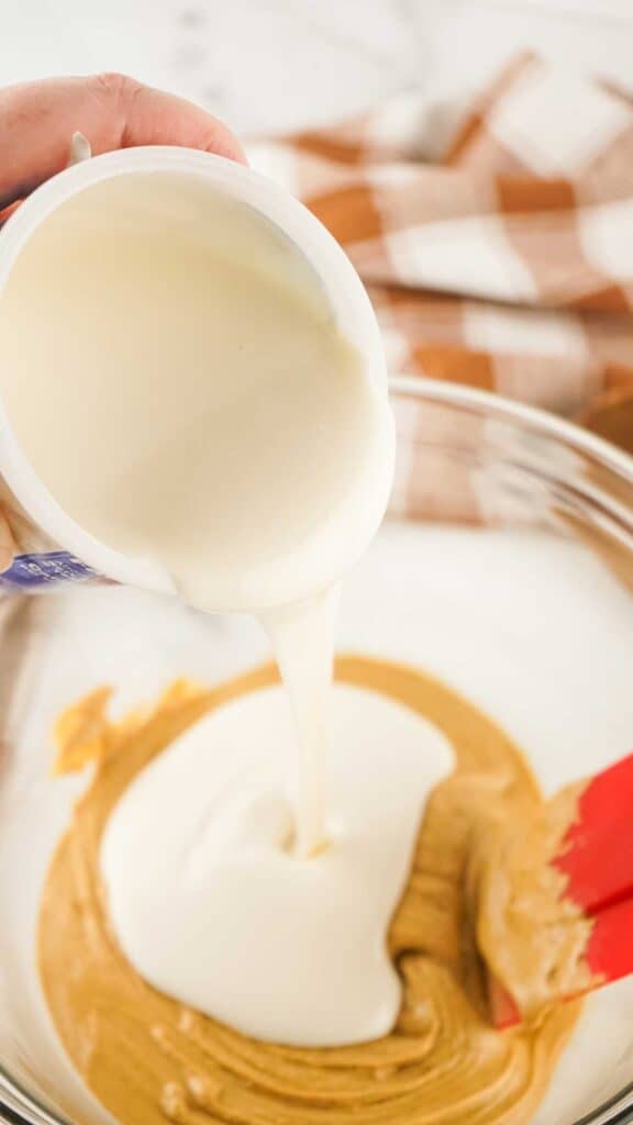 pouring melted icing into bowl