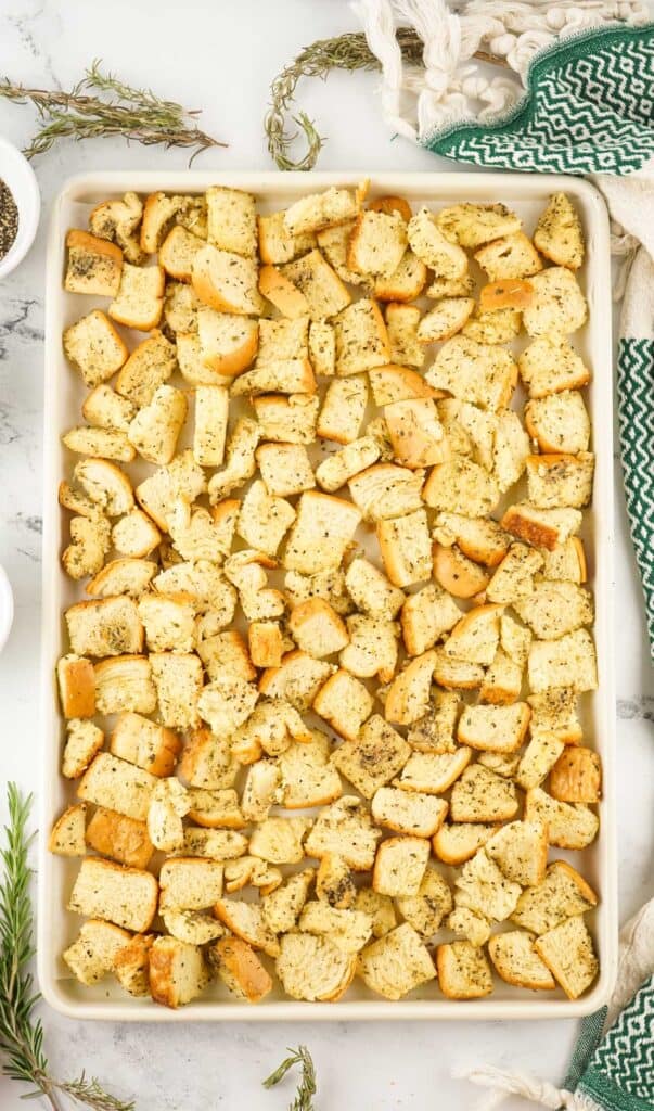 homemade croutons on baking sheet before baking