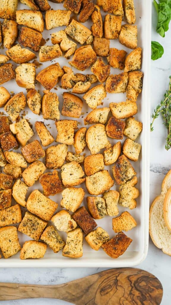 homemade sourdough croutons on baking sheet