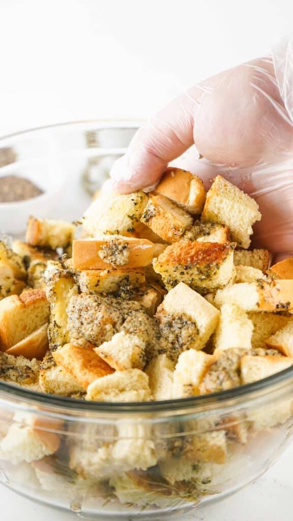 mixing bread cubes to make croutons