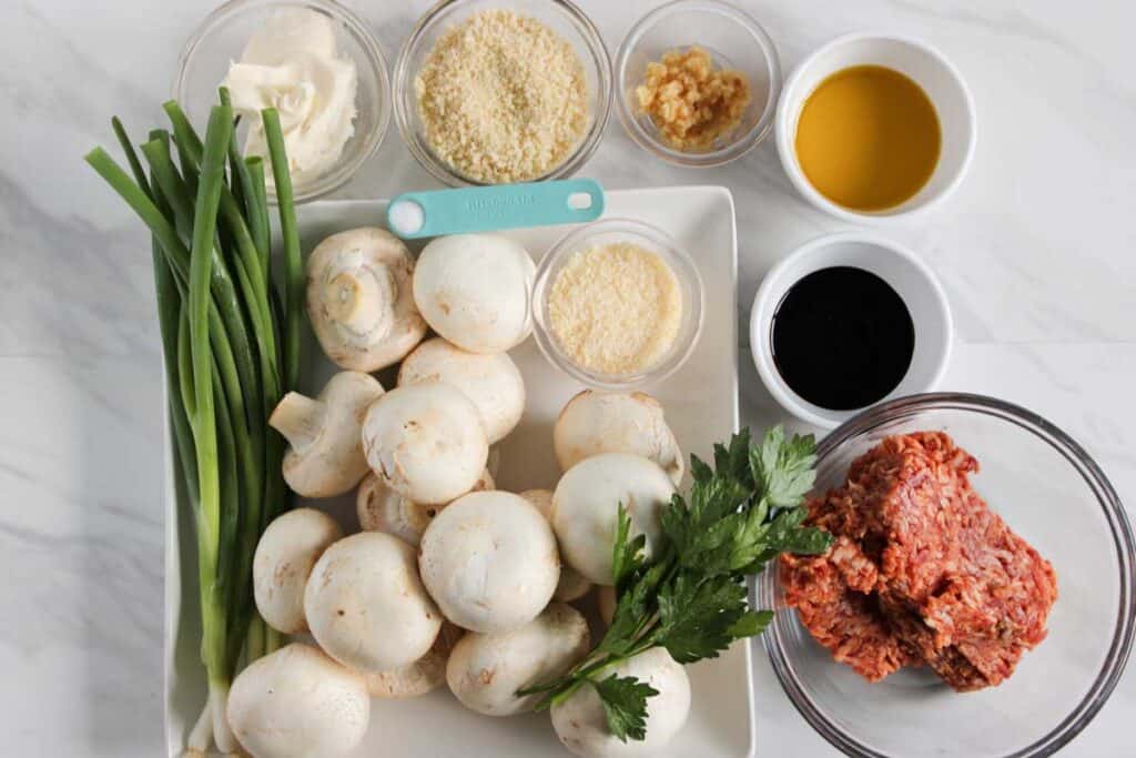 stuffed mushroom ingredients on marble countertop