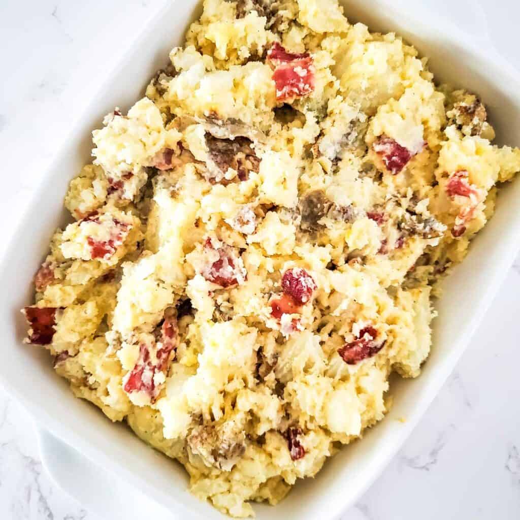 twice baked potato casserole in baking dish before baking