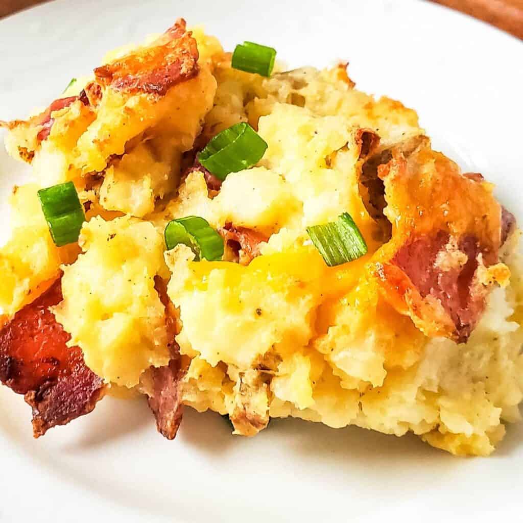 twice baked potato casserole on white plate close up