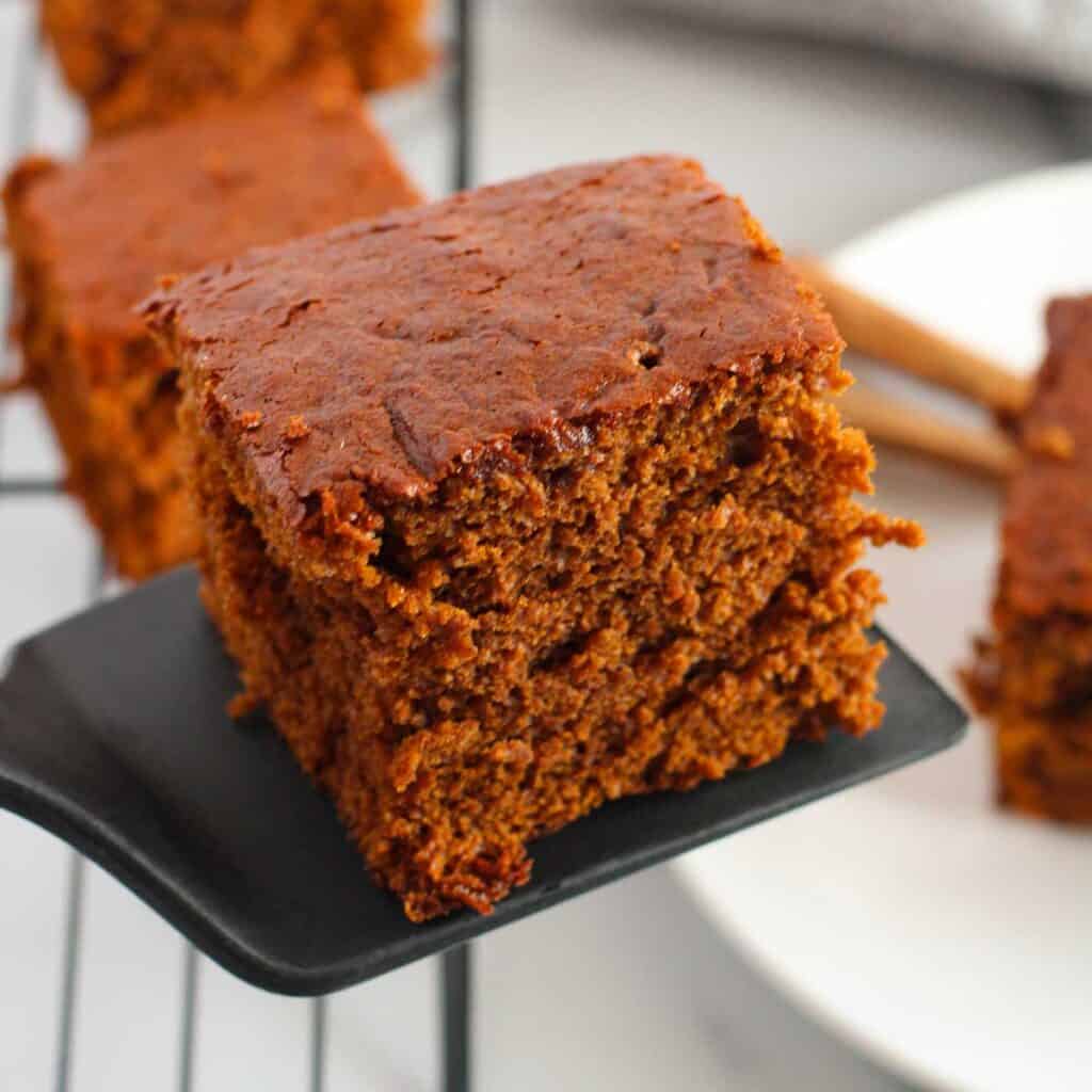 spatula holding slice of gingerbread cake