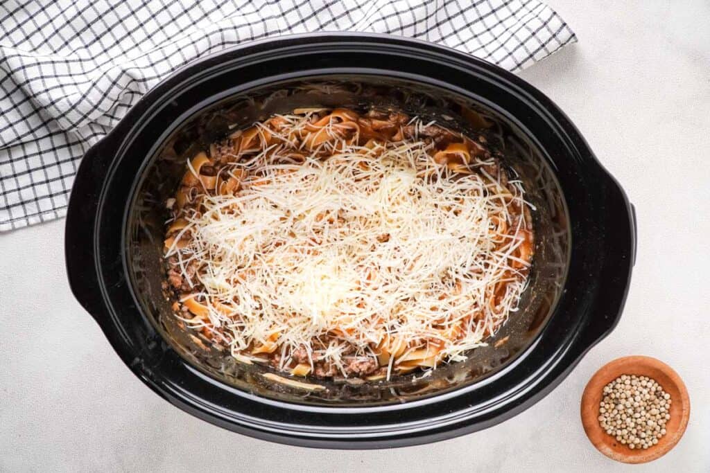 ground beef and noodles topped with cheese 