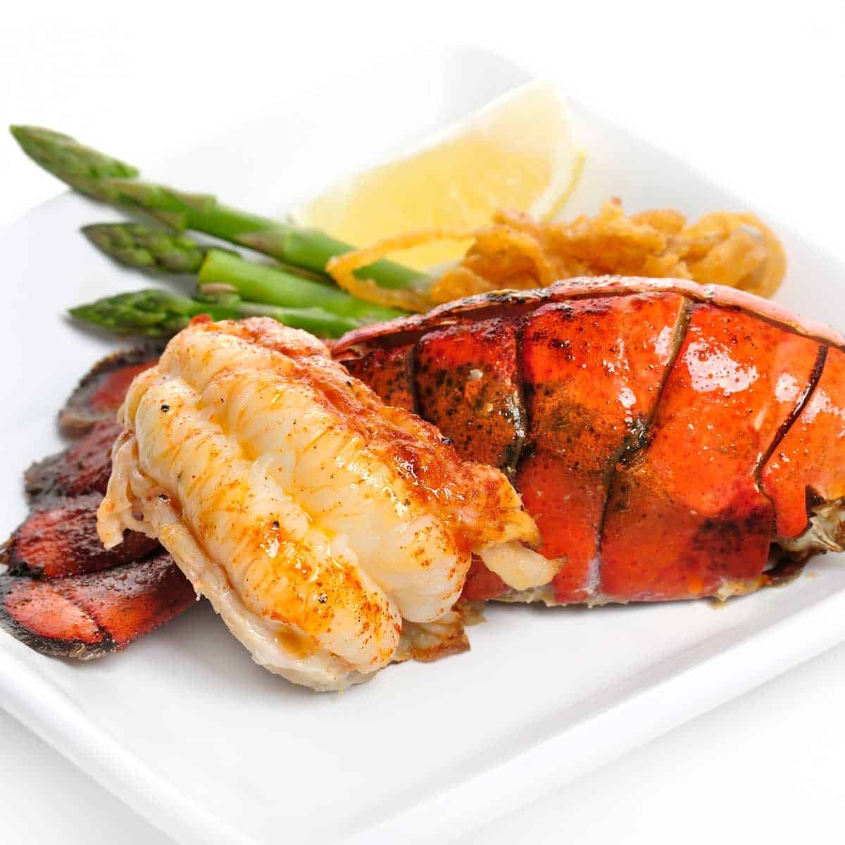 lobster tails on white plate