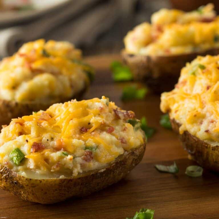 twice baked potatoes on cutting board
