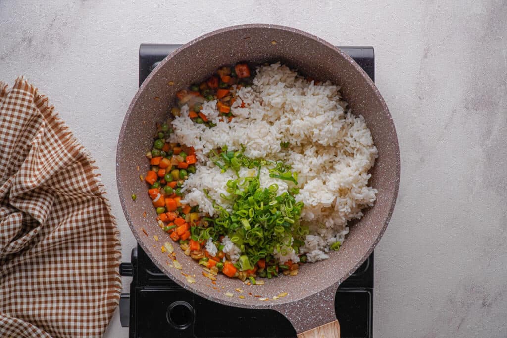 white rice and vegetables in skillet for fried rice