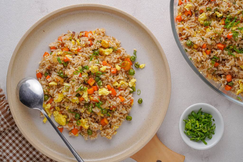 serving of egg fried rice on plate with spoon