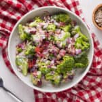 colorful broccoli salad in white bowl