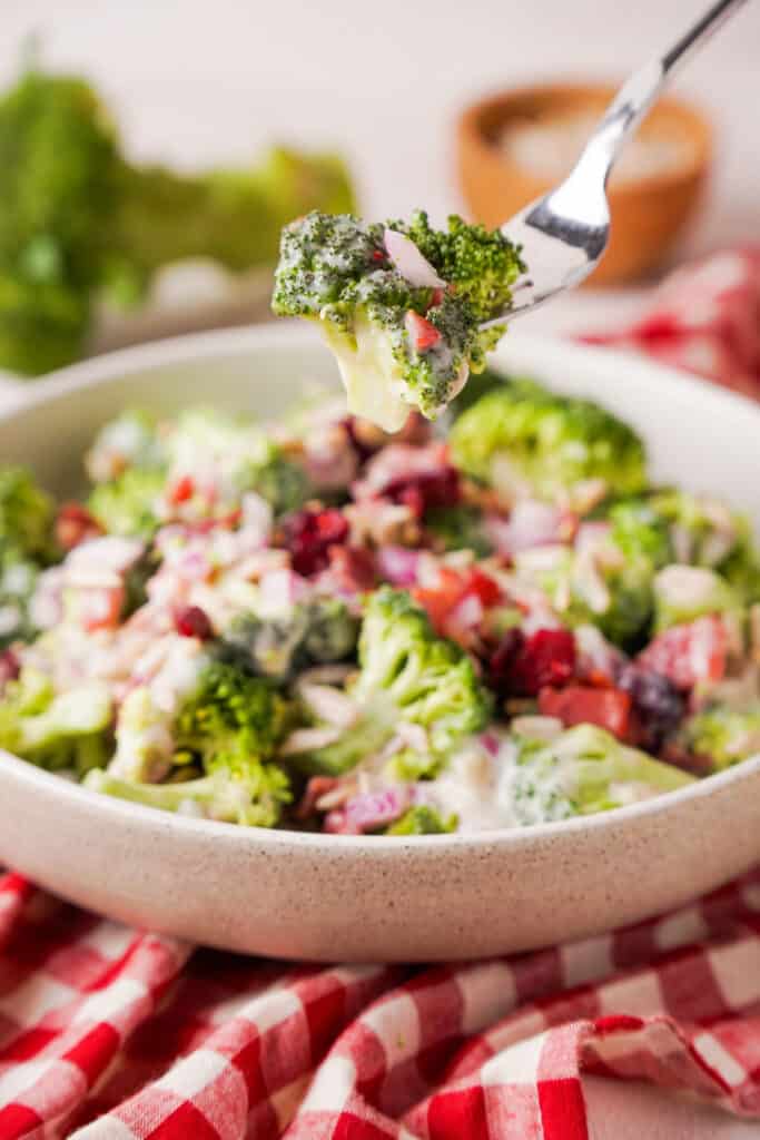 fork with broccoli salad over bowl