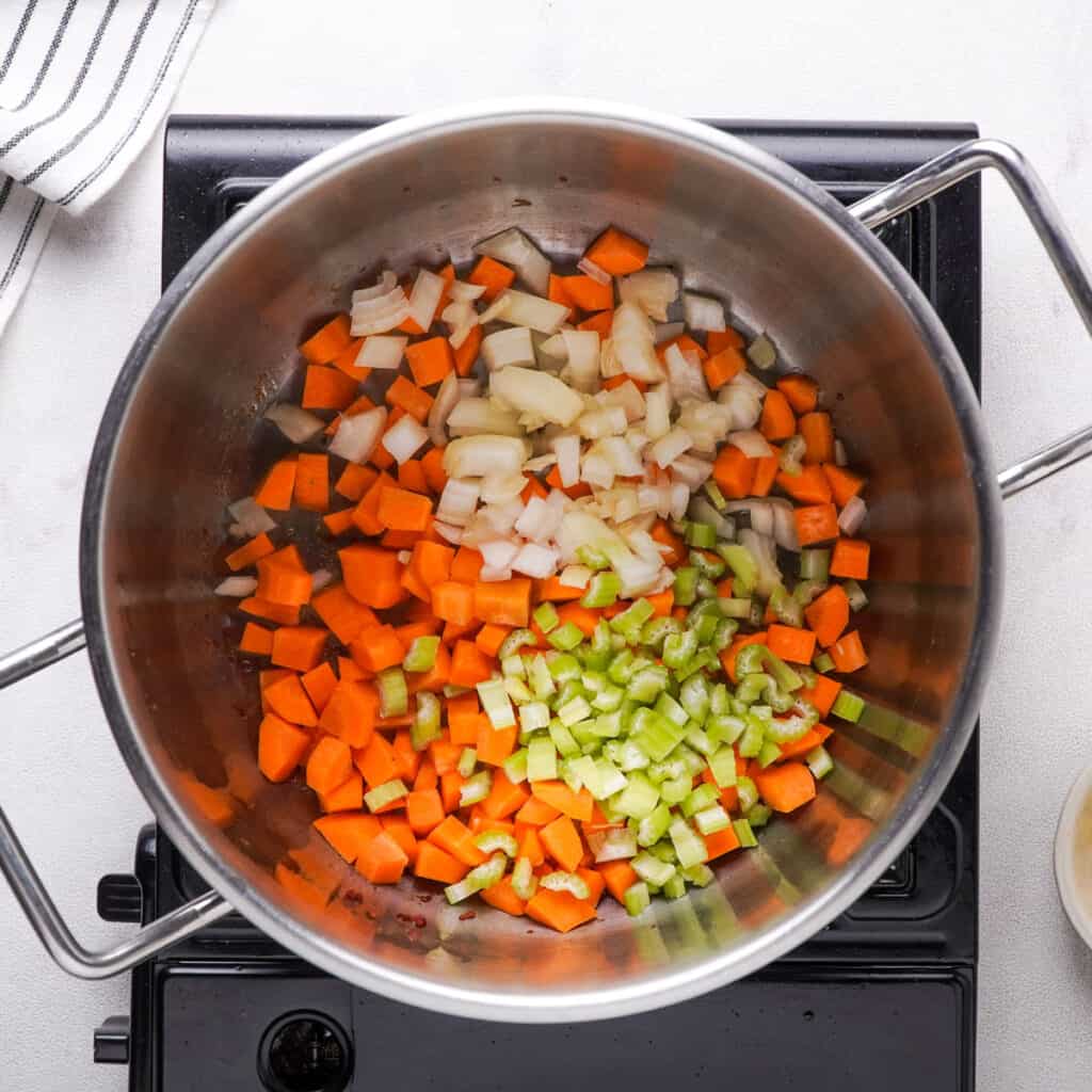 corn, onion, and celery in pot