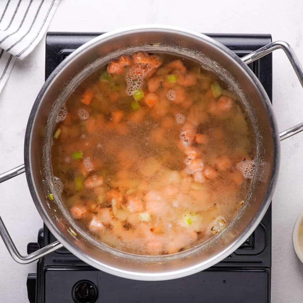pot with broth and vegetables