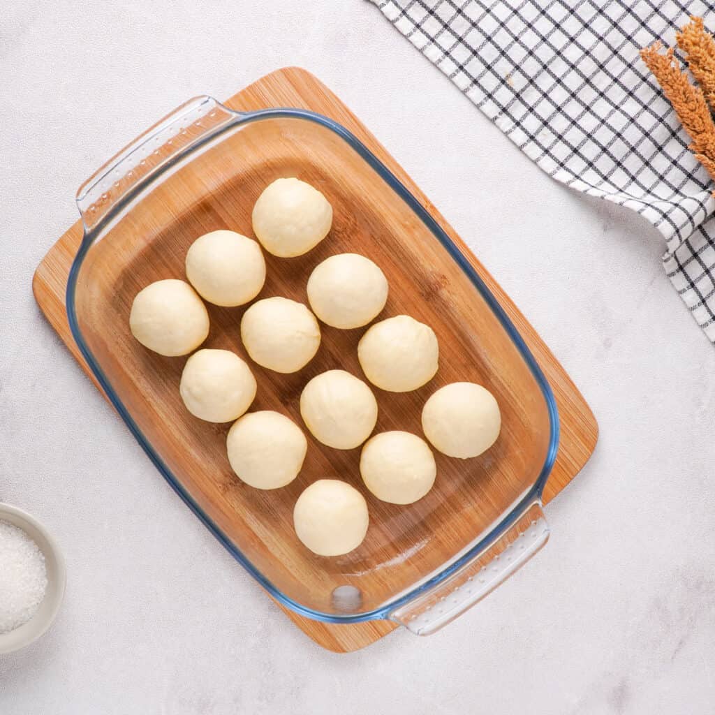 dough balls in glass dish