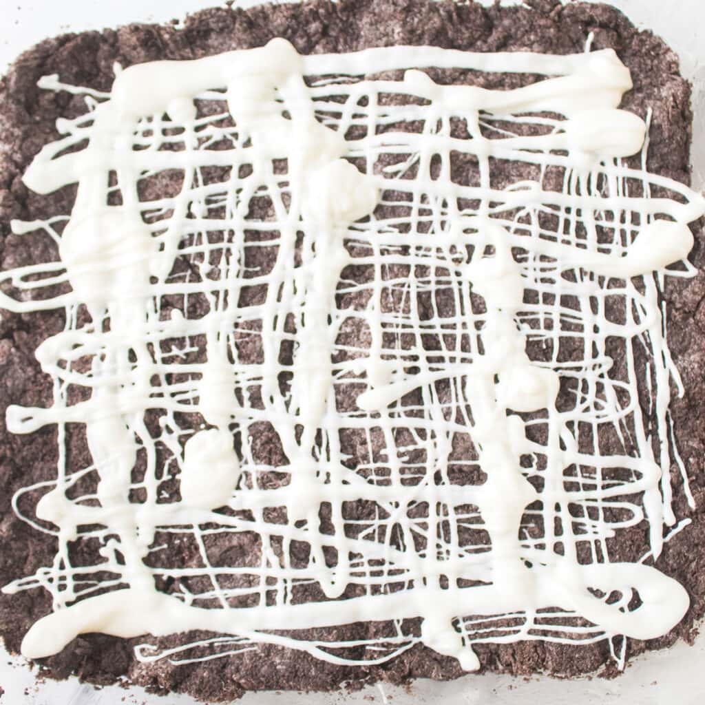 OREO marshmallow bars in dish with marshmallow drizzle