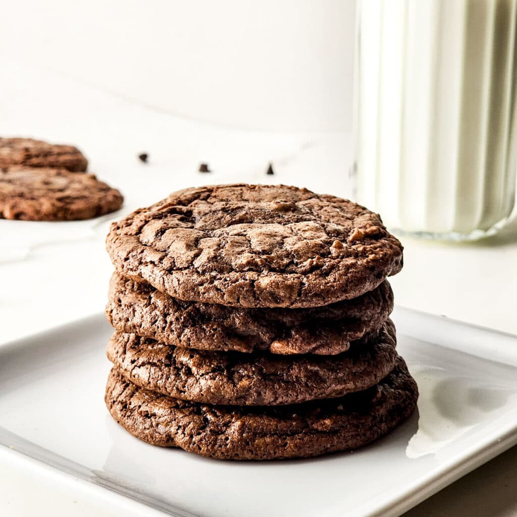 brownie cookies stacked on white plate