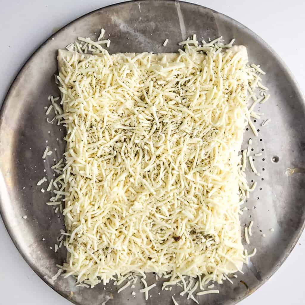 cheesy garlic breadsticks before baking