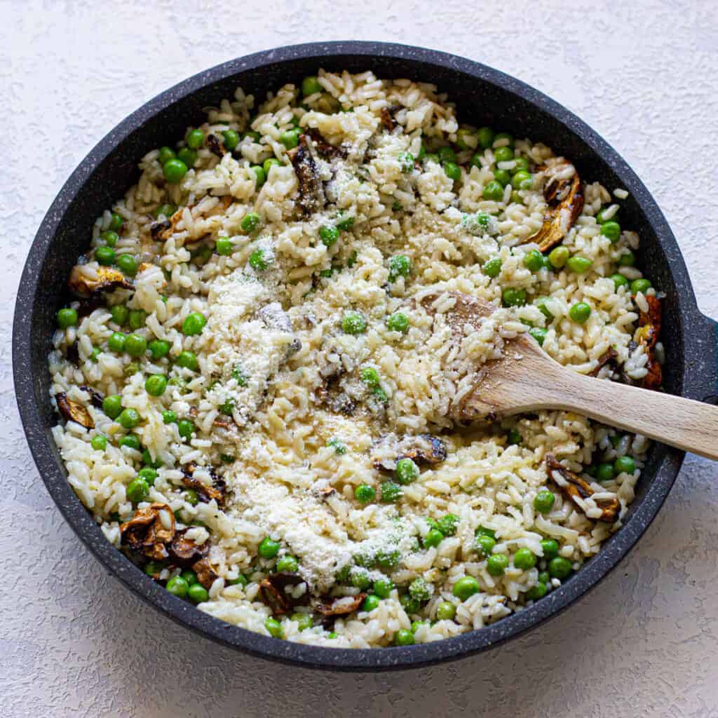risotto with peas in skillet