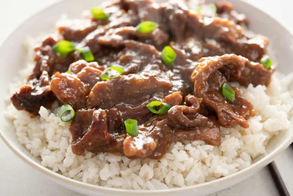 close up of Mongolian beef in bowl