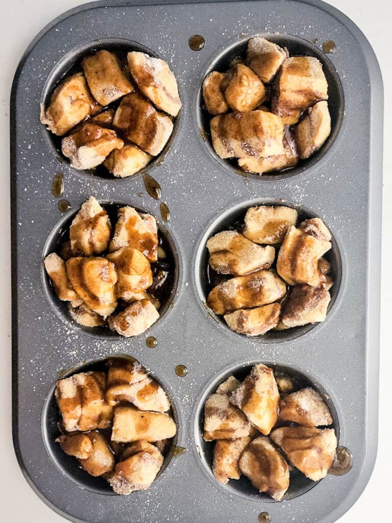 monkey bread muffins with syrup before baking