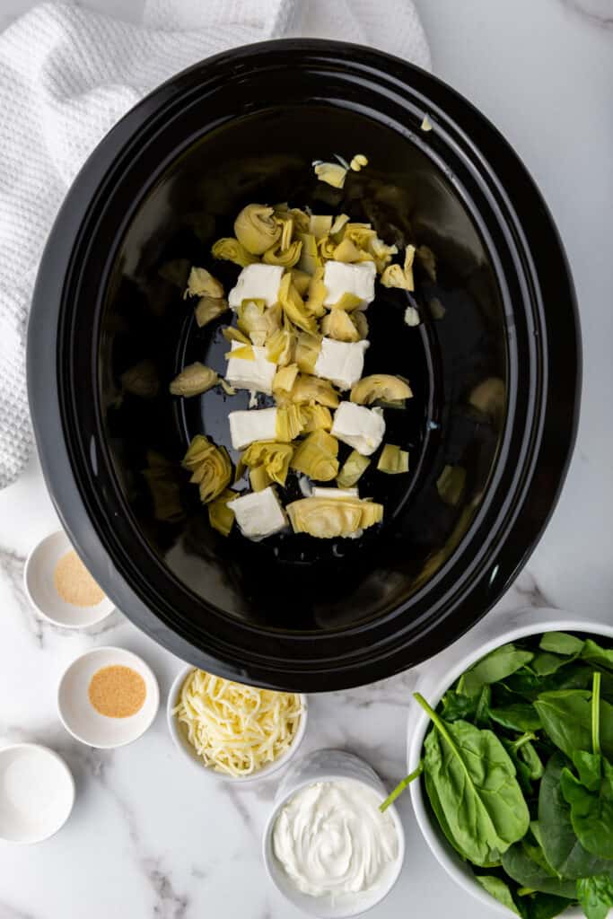 cream cheese and artichoke hearts in slow cooker