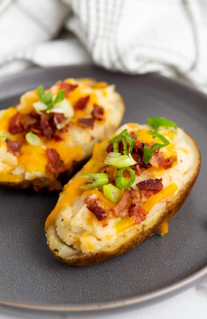two twice baked potatoes on plate