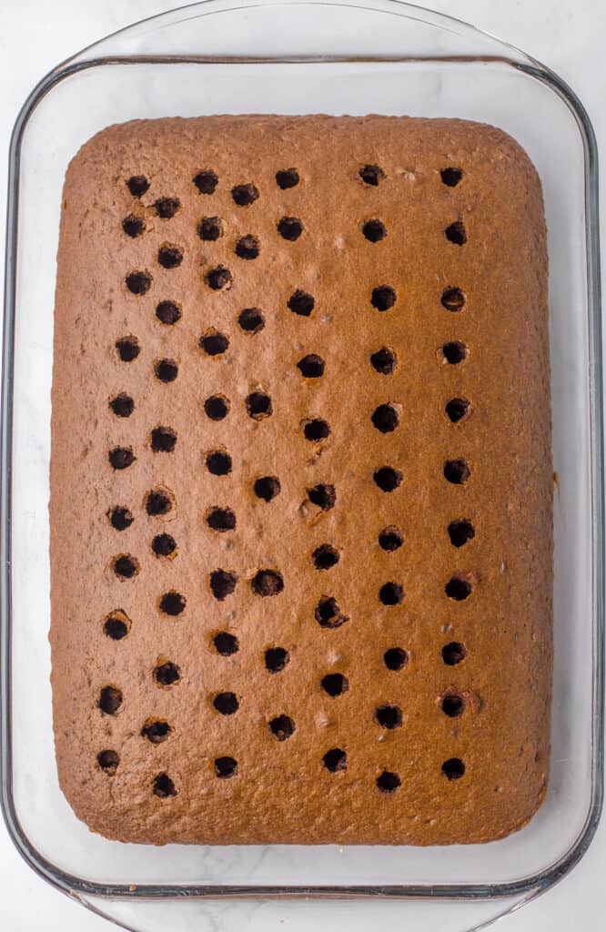 chocolate cake with holes poked in it