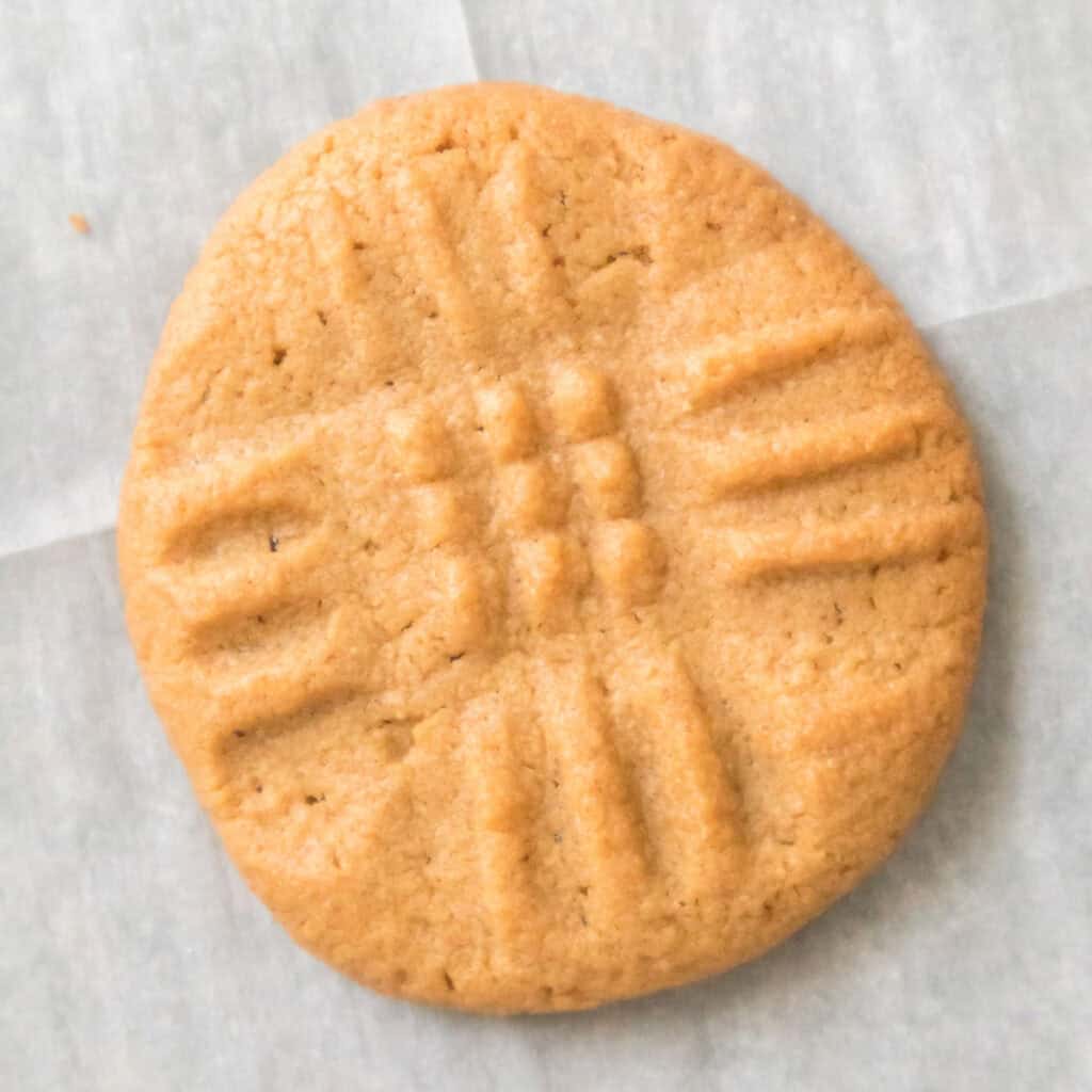 3 ingredient peanut butter cookie on parchment paper