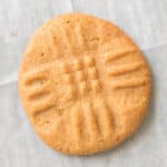 3 ingredient peanut butter cookie on parchment paper